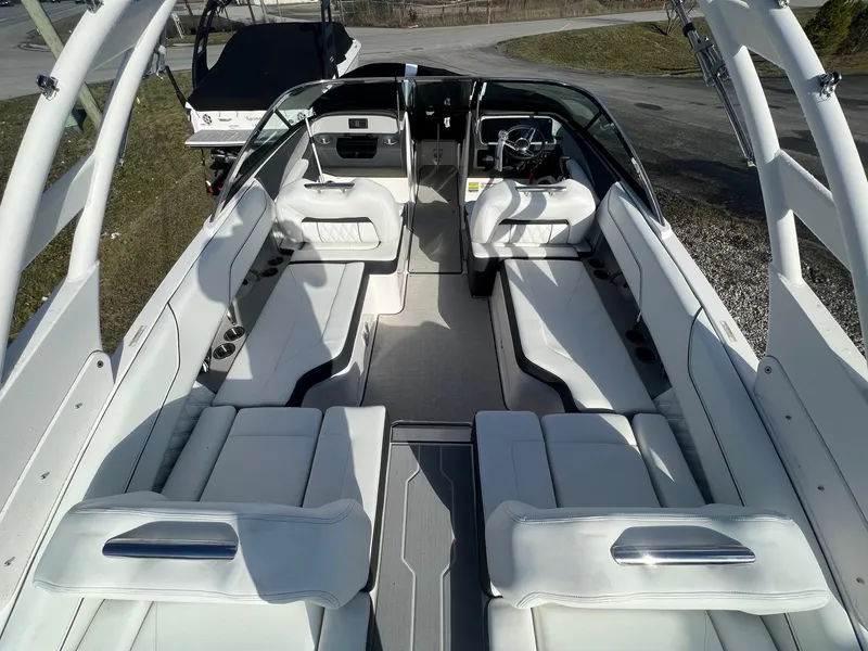 Slide: The Image of 2025 Regal LS4 boat interior with luxurious white seating and modern design. - 8