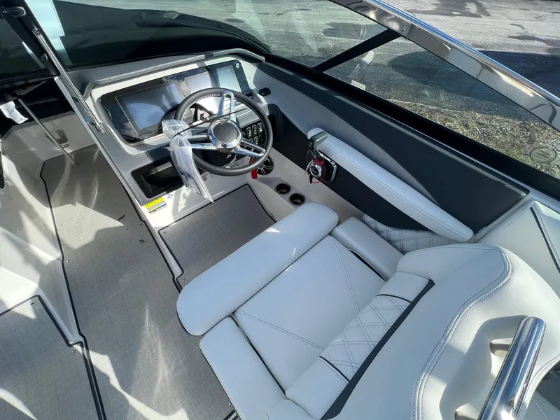 Slide: The Image of 2025 Regal LS4 boat interior with modern steering and white seating. - 9