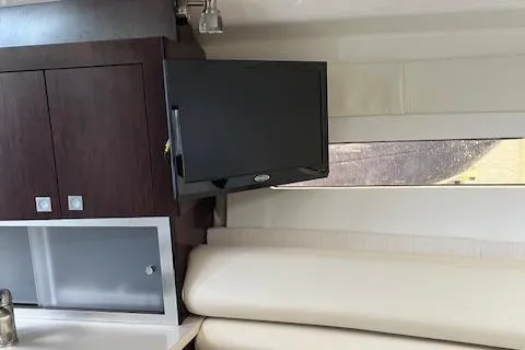 Slide: The Image of Interior of 2021 Monterey 295 Sport Yacht with TV and cabinets. - 1