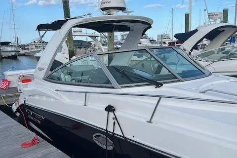 Slide: The Image of 2021 Monterey 295 Sport Yacht docked at marina, sleek design, clear skies. - 11