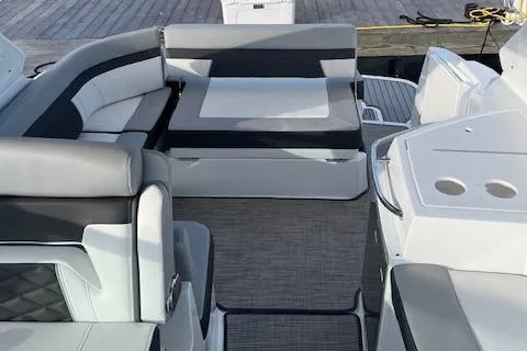 Slide: The Image of 2021 Monterey 295 Sport Yacht interior with sleek seating and modern design. - 14