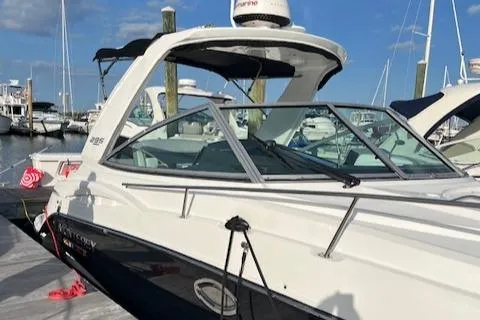 Slide: The Image of 2021 Monterey 295 Sport Yacht docked at marina under clear blue sky. - 8