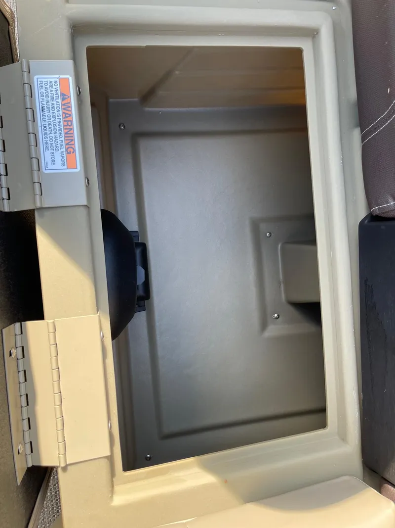 Slide: The Image of Storage compartment of 2025 Sylvan 820 Mirage Cruise boat, open and empty. - 17