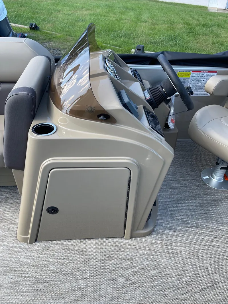 Slide: The Image of 2025 Sylvan 820 Mirage Cruise boat console with steering wheel and seating. - 20