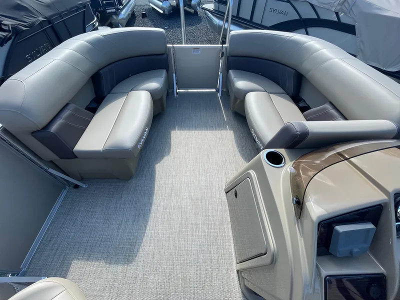 Slide: The Image of 2025 Sylvan 820 Mirage Cruise interior with plush seating and modern design. - 21