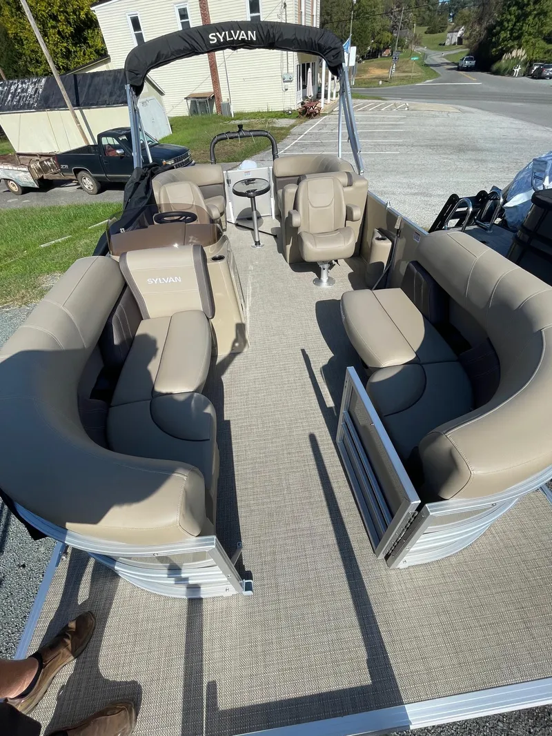 Slide: The Image of 2025 Sylvan 820 Mirage Cruise pontoon boat with spacious seating and modern design. - 5