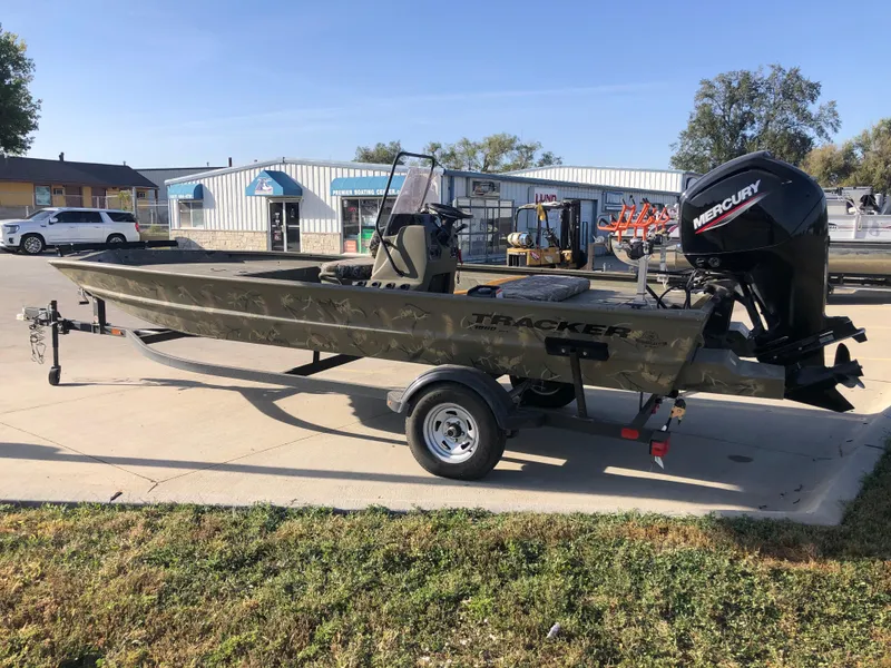 Slide: The Image of 2022 Tracker Grizzly 1860 CC boat with Mercury engine on trailer. - 2
