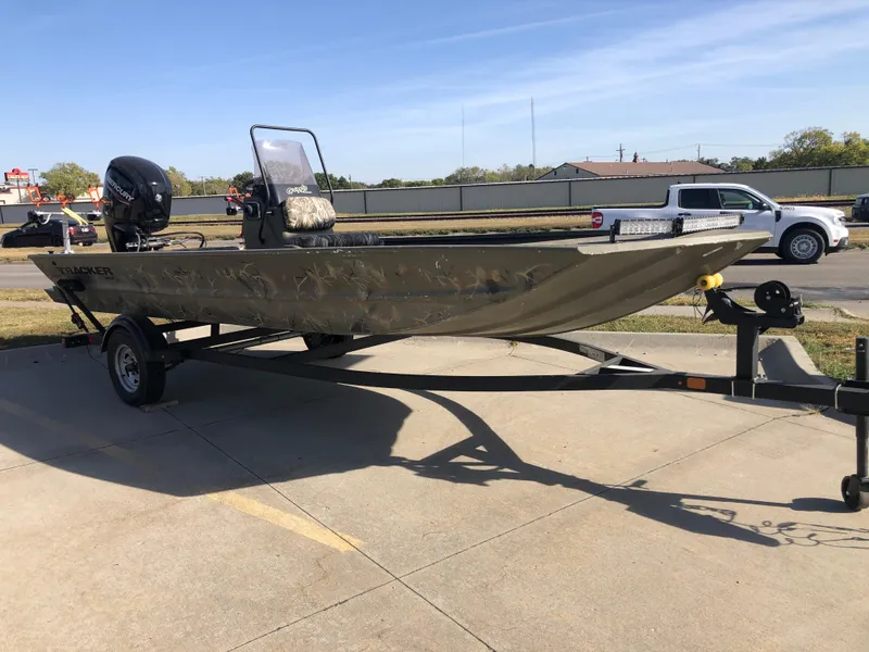 Slide: The Image of 2022 Tracker Grizzly 1860 CC boat on trailer in parking lot. - 3