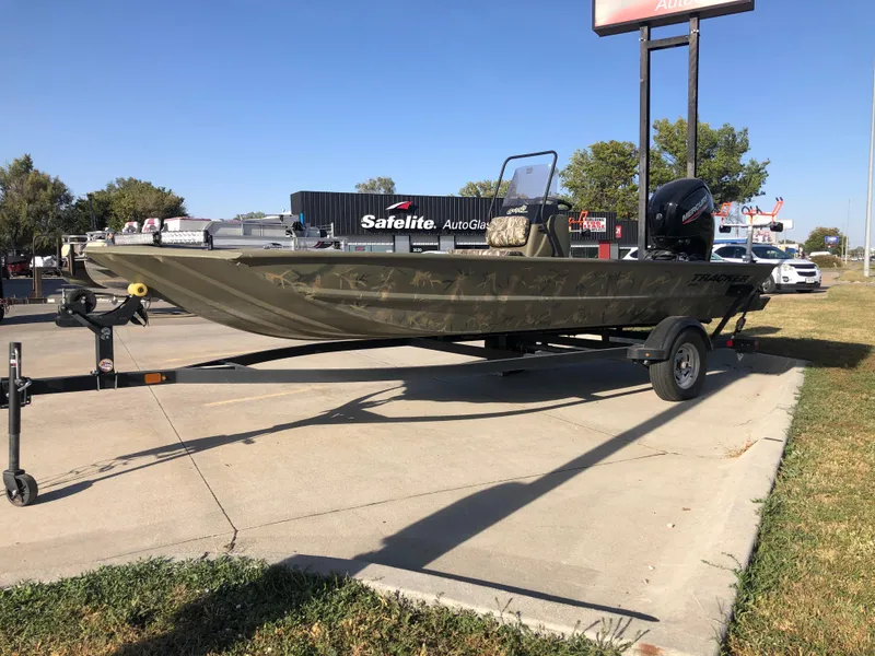 Slide: The Image of 2022 Tracker Grizzly 1860 CC boat on trailer in parking lot. - 4