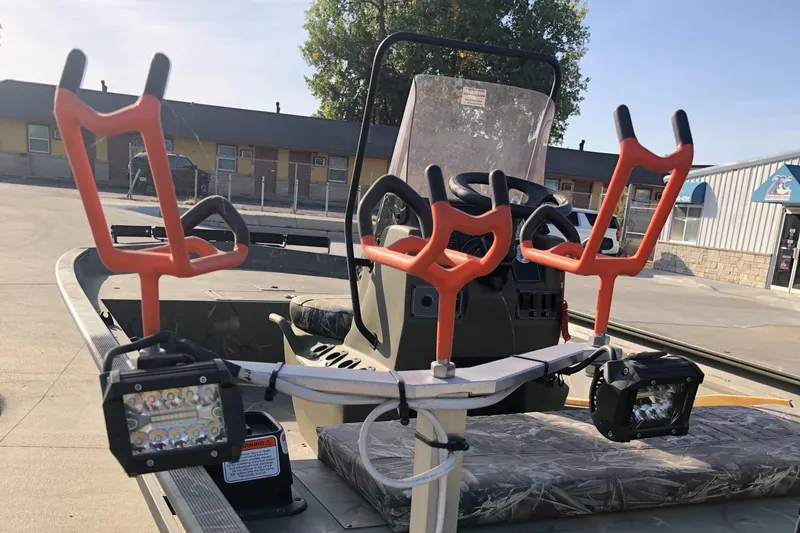 Slide: The Image of 2022 Tracker Grizzly 1860 CC boat with rod holders and LED lights. - 8