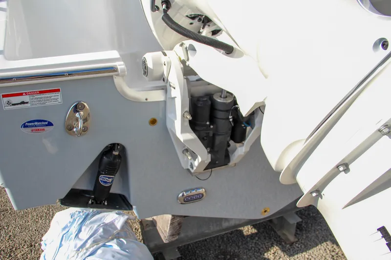Slide: The Image of Close-up of 2025 Sea Hunt Ultra 265 SE boat engine mount and components. - 11