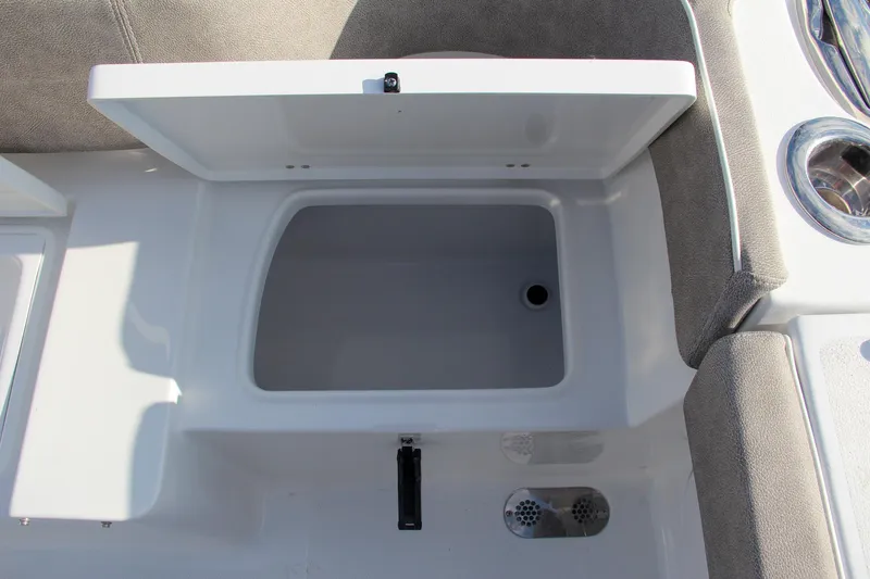 Slide: The Image of Open storage compartment on 2025 Sea Hunt Ultra 265 SE boat. - 18