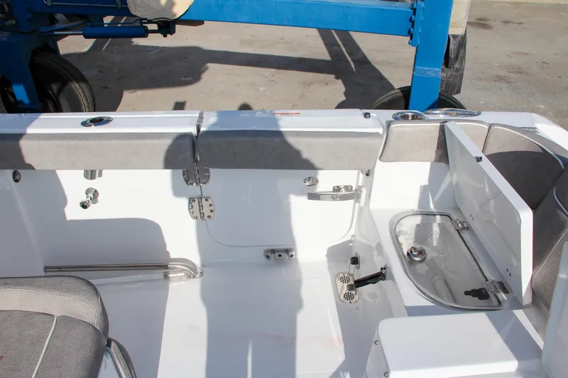 Slide: The Image of Interior view of 2025 Sea Hunt Ultra 265 SE boat, featuring seating and storage compartments. - 21