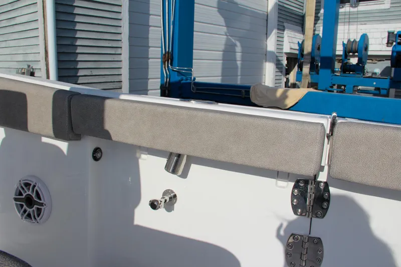 Slide: The Image of Sea Hunt Ultra 265 SE 2025 boat interior with cushioned seating and hardware details. - 22