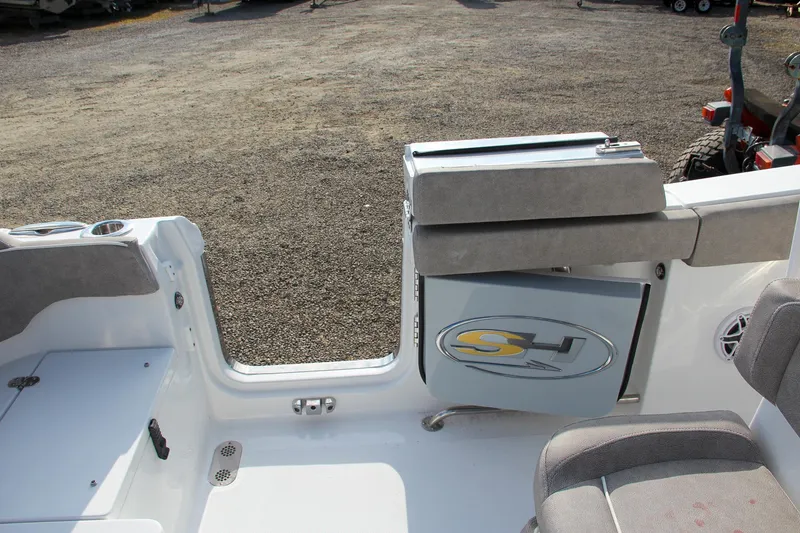 Slide: The Image of 2025 Sea Hunt Ultra 265 SE boat interior with seating and storage. - 25