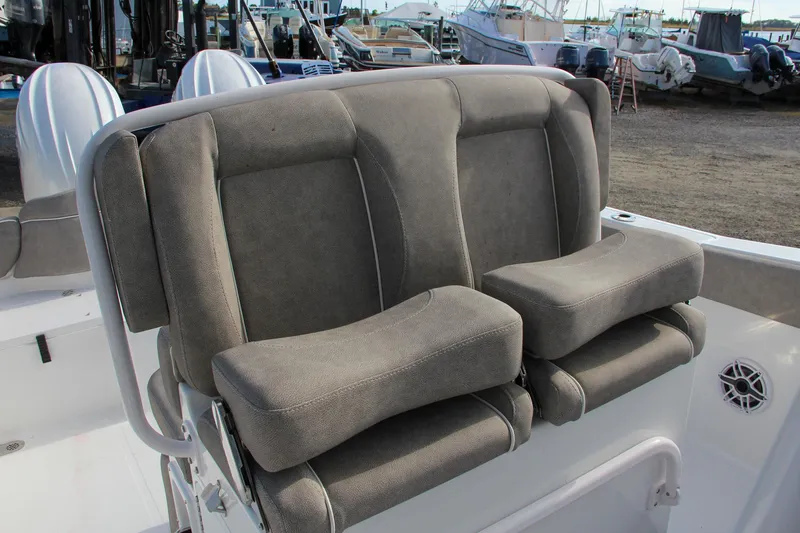 Slide: The Image of 2025 Sea Hunt Ultra 265 SE boat seats, gray upholstery, outdoor setting. - 29