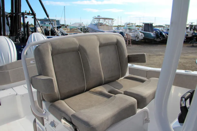 Slide: The Image of 2025 Sea Hunt Ultra 265 SE boat seating in a marina. - 30