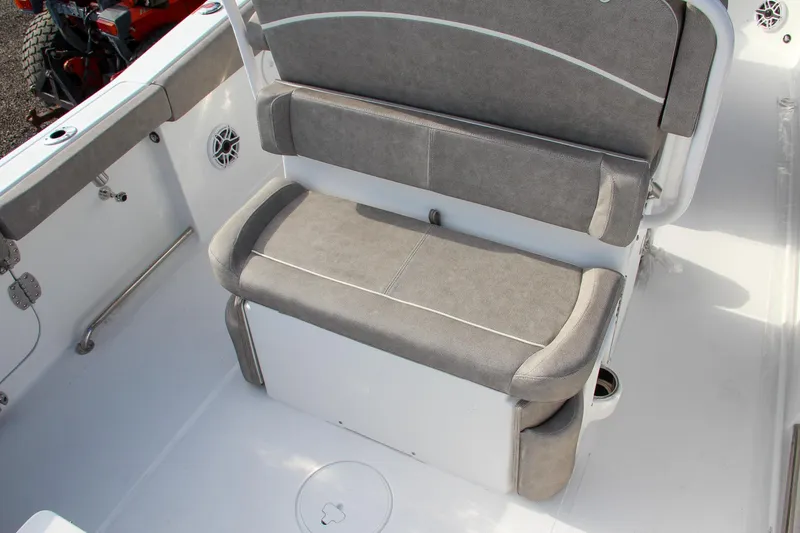 Slide: The Image of 2025 Sea Hunt Ultra 265 SE boat seating area with gray cushions. - 32