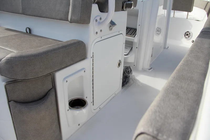 Slide: The Image of 2025 Sea Hunt Ultra 265 SE interior seating and storage area. - 36