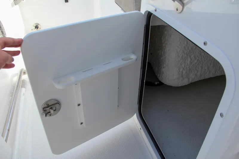 Slide: The Image of Open storage compartment on 2025 Sea Hunt Ultra 265 SE boat. - 37