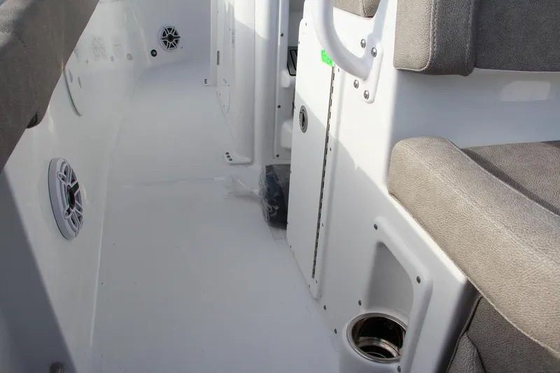 Slide: The Image of 2025 Sea Hunt Ultra 265 SE boat interior with seating and speakers. - 38
