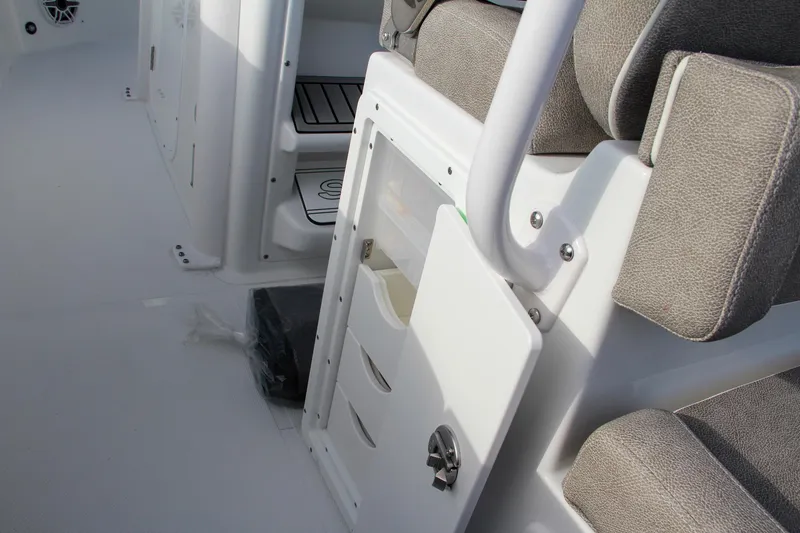 Slide: The Image of Interior of 2025 Sea Hunt Ultra 265 SE boat with storage compartments and seating. - 39