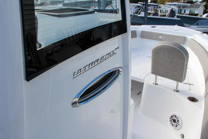 Slide: The Image of 2025 Sea Hunt Ultra 265 SE boat interior detail with seating and logo. - 4