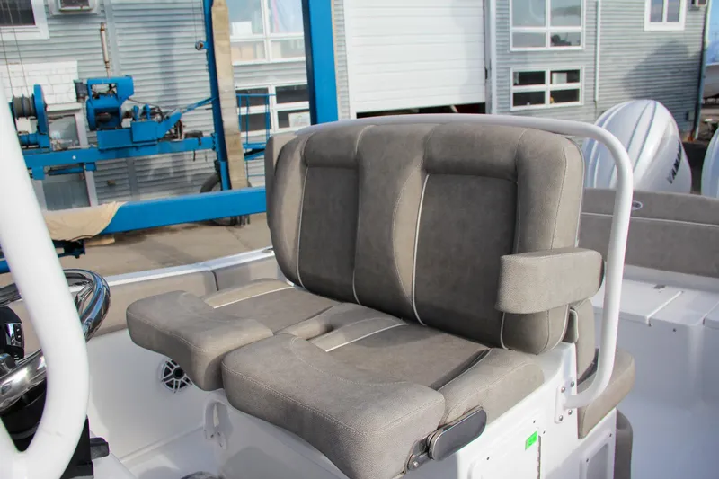 Slide: The Image of 2025 Sea Hunt Ultra 265 SE boat seating with cushioned armrests. - 40