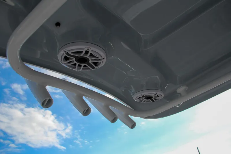 Slide: The Image of Sea Hunt Ultra 265 SE 2025 boat speakers and rod holders against blue sky. - 41
