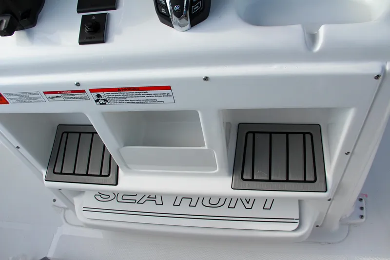 Slide: The Image of Sea Hunt Ultra 265 SE 2025 boat interior with branded step and controls. - 42