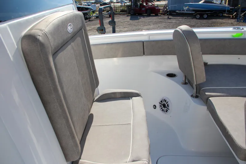 Slide: The Image of 2025 Sea Hunt Ultra 265 SE boat interior seating area. - 6