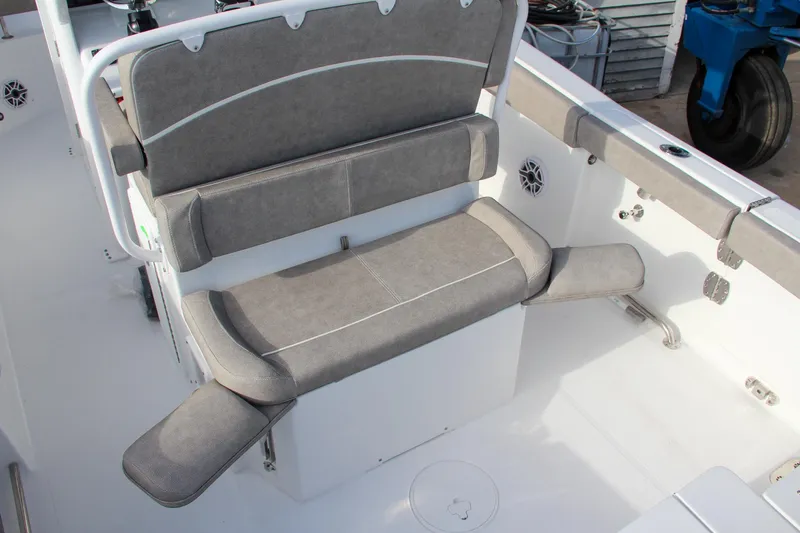 Slide: The Image of 2025 Sea Hunt Ultra 265 SE boat interior with cushioned seating and storage. - 8