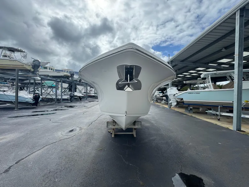 Slide: The Image of 2022 Sea Pro 259 Center Console boat in storage facility. - 14