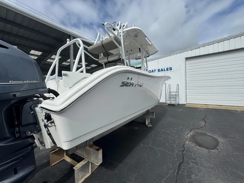 Slide: The Image of 2022 Sea Pro 259 Center Console boat displayed at dealership. - 15
