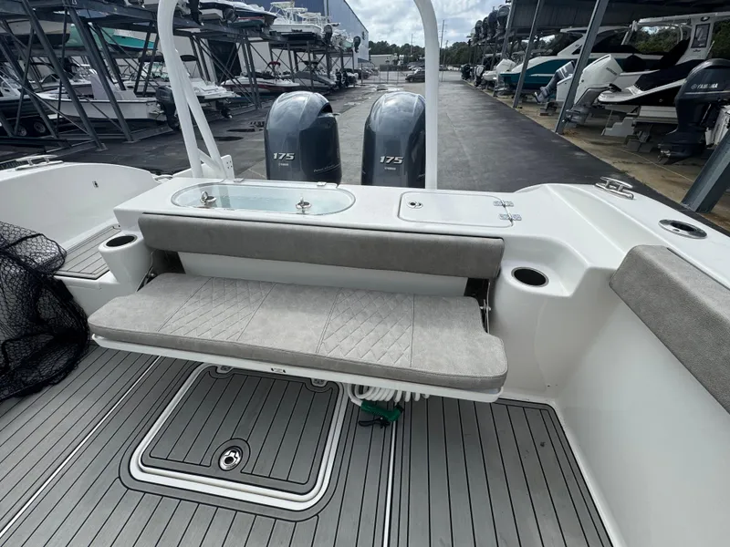 Slide: The Image of 2022 Sea Pro 259 Center Console boat with dual 175 engines and cushioned seating. - 18