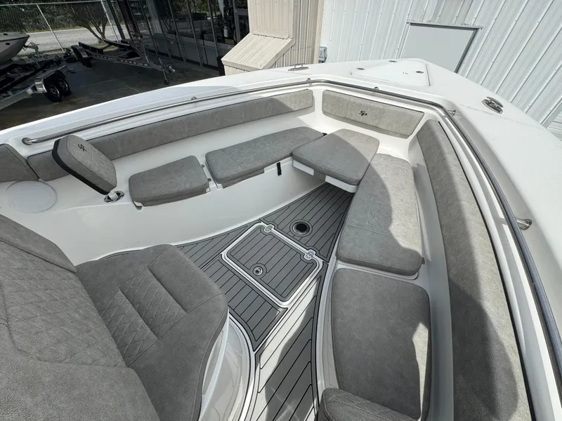 Slide: The Image of 2022 Sea Pro 259 Center Console boat with spacious seating and modern design. - 28