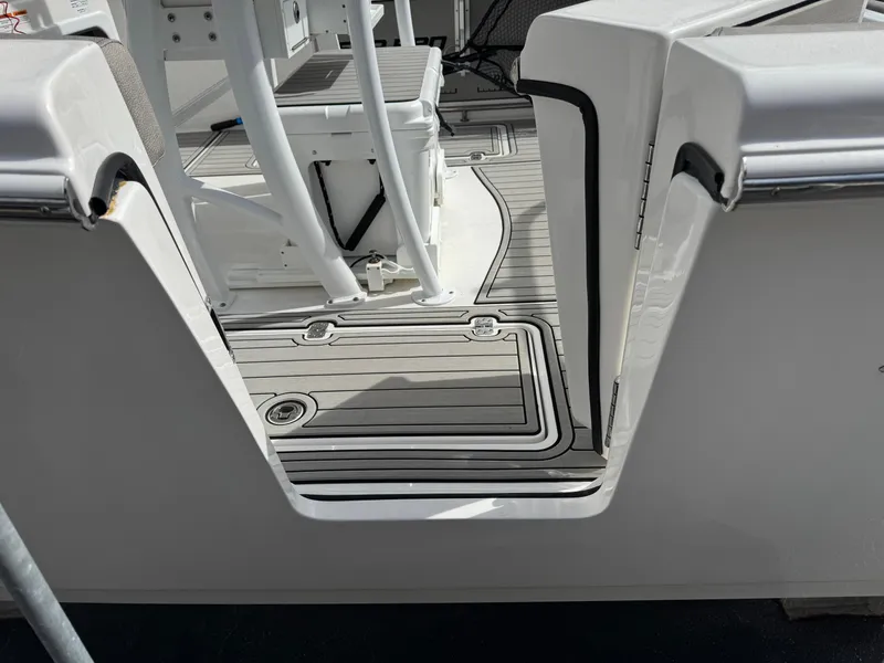 Slide: The Image of 2022 Sea Pro 259 Center Console boat deck with seating and storage. - 36