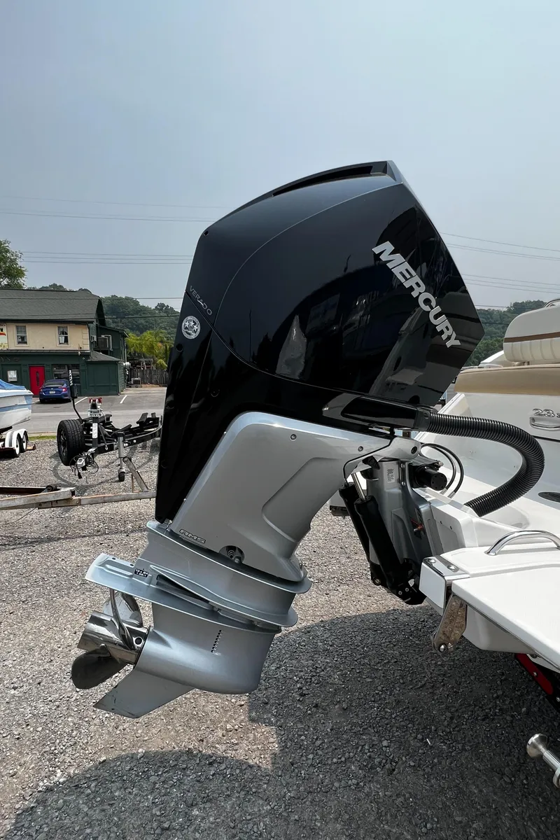 Slide: The Image of 2021 Cobalt 23SC boat with Mercury outboard motor in a parking lot. - 3