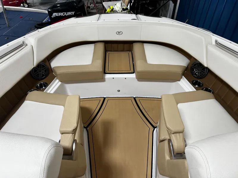 Slide: The Image of 2021 Cobalt 23SC boat interior with tan and white seating. - 6