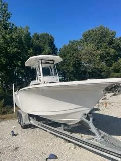 Slide: The Image of 2023 Tidewater 232 SS boat on trailer, parked outdoors. - 18