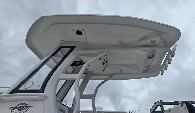 Slide: The Image of 2023 Tidewater 232 SS boat with T-top against cloudy sky. - 6