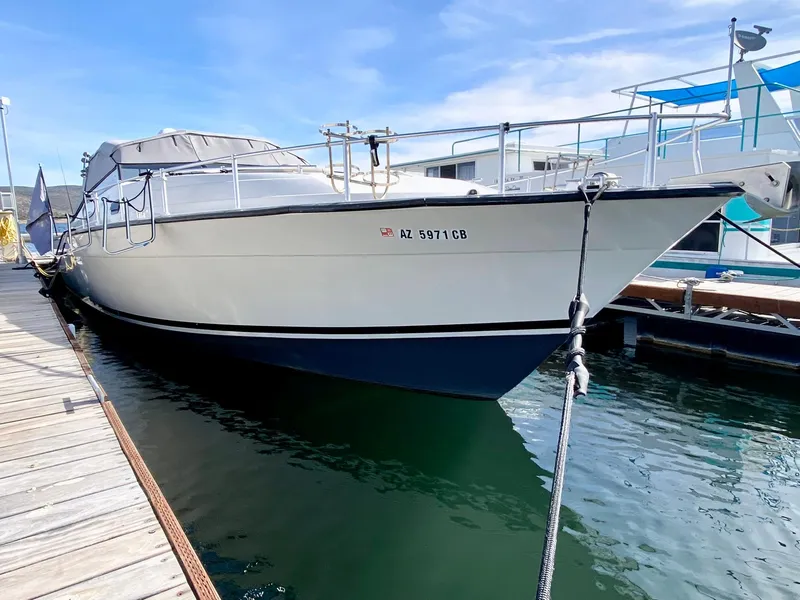 Slide: The Image of 1989 Mainship 39 Mediterranean Express docked at marina. - 15