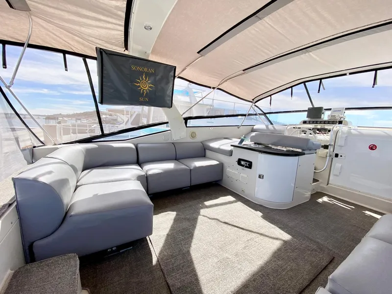 Slide: The Image of 1989 Mainship 39 Mediterranean Express yacht interior with spacious seating and modern helm. - 17