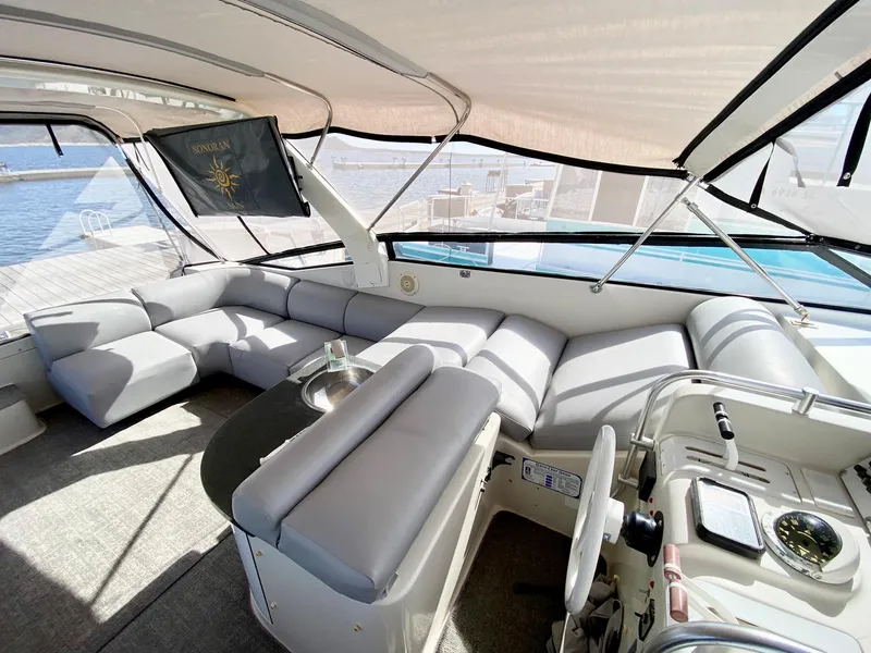 Slide: The Image of Luxurious 1989 Mainship 39 Mediterranean Express yacht interior with spacious seating and helm. - 18