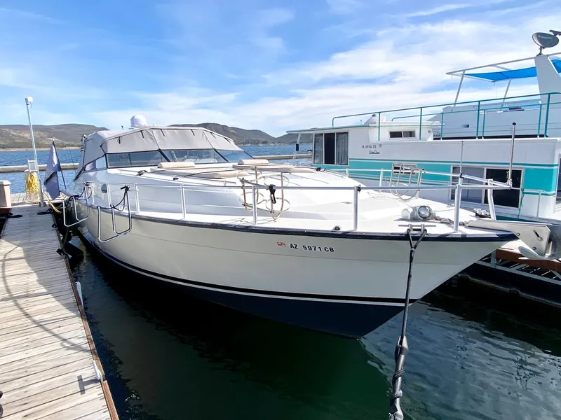 Slide: The Image of 1989 Mainship 39 Mediterranean Express yacht docked at marina. - 2