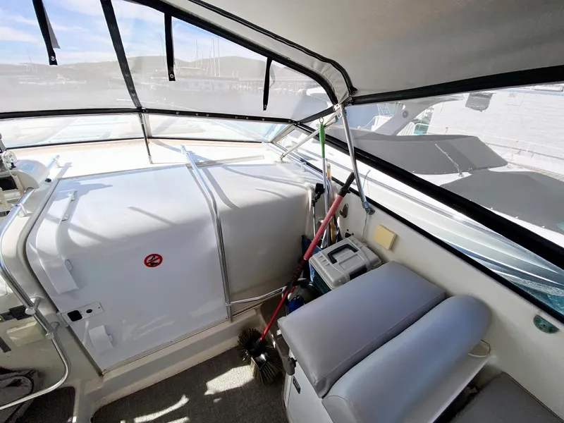 Slide: The Image of 1989 Mainship 39 Mediterranean Express cockpit with seating and navigation equipment. - 20