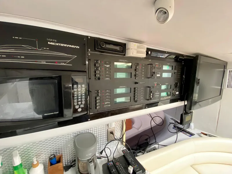 Slide: The Image of Control panel and appliances in 1989 Mainship 39 Mediterranean Express yacht interior. - 24