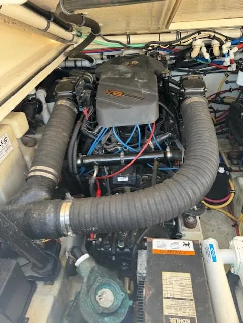 Slide: The Image of Engine compartment of a 2001 Pursuit 3000 Express boat with V8 engine. - 16