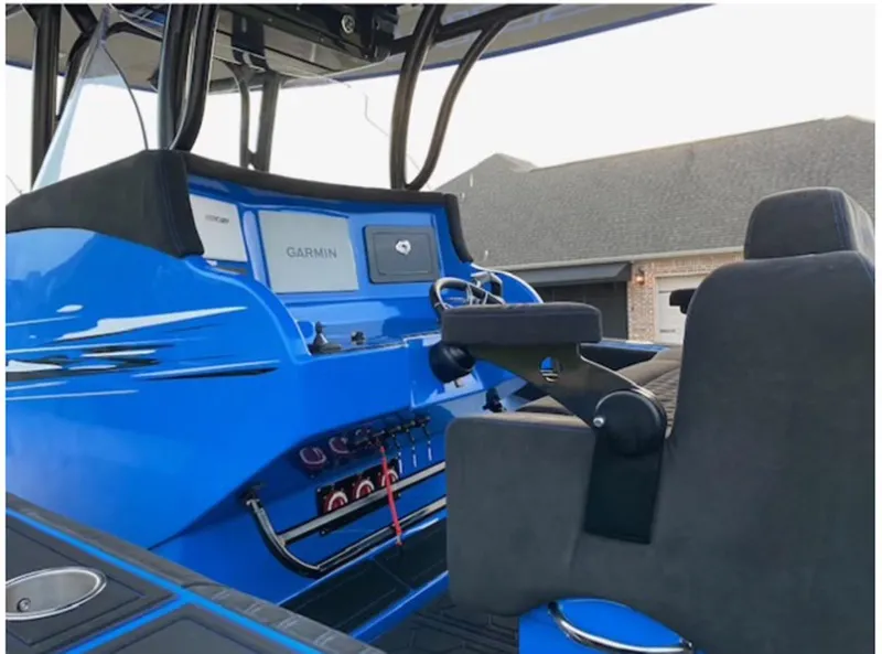 Slide: The Image of 2021 Statement 380 Open boat cockpit with Garmin navigation system. - 10