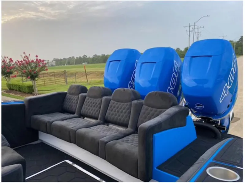 Slide: The Image of 2021 Statement 380 Open boat with triple blue 400 engines and luxurious seating. - 16